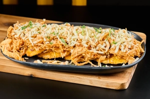 TOSTONES WITH CHICKEN IN HOUSE SAUCE