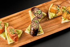 PORK CRACKLINGS, CHORIZO OR BLOOD SAUSAGE BITES WITH GUACAMOLE & AREPA
