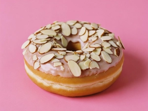 Almond Donut topped with sliced almonds and glaze in Dallas.