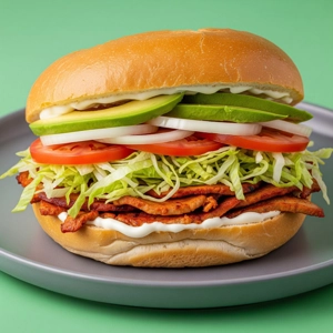 Al Pastor Torta with visible al pastor meat, lettuce, and tomato in Dallas.