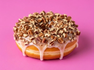 Pecan donut with chopped pecans and glaze in Dallas.