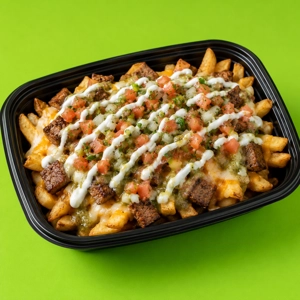 Loaded Steak Fries topped with melted cheese, beef fajita, and pico de gallo in Dallas.