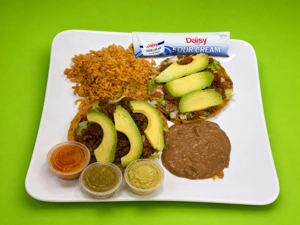 Sopes Plate with beef, avocado, and rice in Dallas.