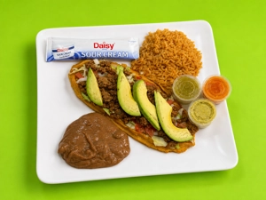Huarache Plate with beef, avocado, and rice served in Dallas.