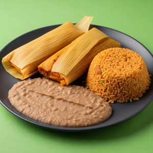 Tamale plate with corn husk-wrapped tamales, refried beans, and Mexican rice in Dallas.