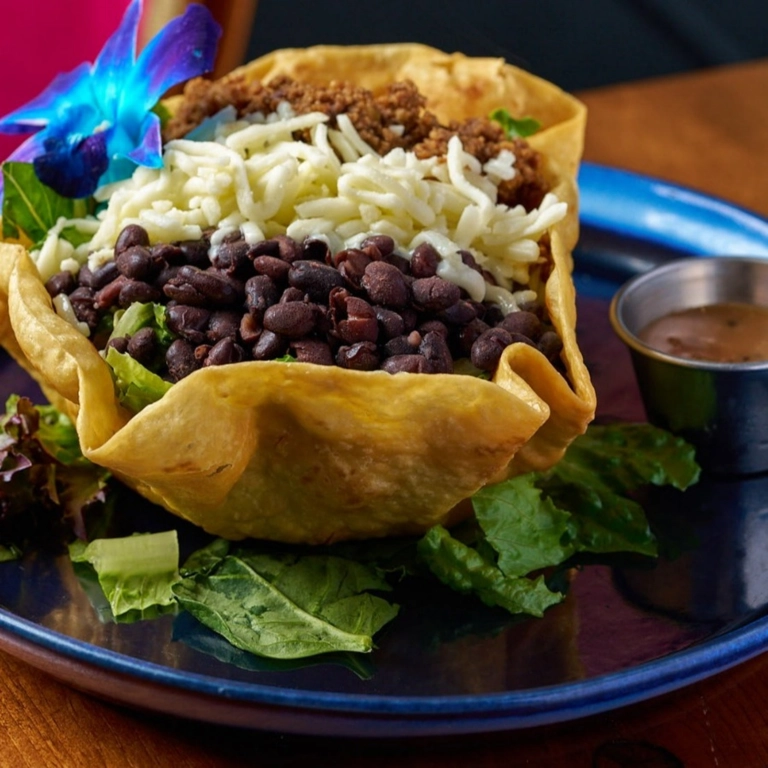 Taco Salad with black beans, shredded cheese, and a crispy tortilla bowl in Wantagh.