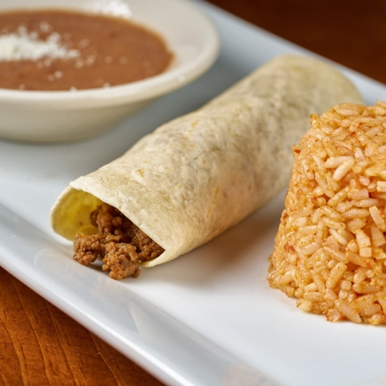 Kid Beef Burrito with ground beef and tortilla, served with Mexican rice in Wantagh.