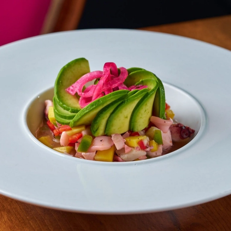 La Viagra dish with sliced avocado, pickled onions, and mixed vegetables at a restaurant in Wantagh.