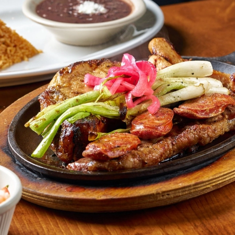 Margarita Skillet with grilled sausage, onions, and pickled onions in Wantagh.