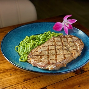 Green pasta with ribeye