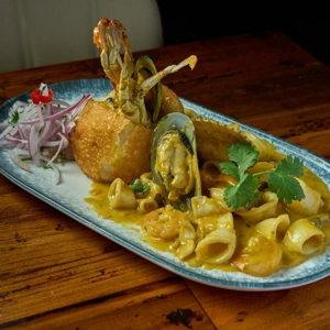 Stuffed potato with seafood sauce