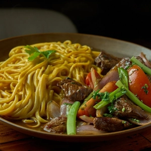 Huancaina noodles with skirt steak
