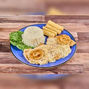 Pechuga Hawaiana with grilled pineapple, creamy sauce, rice, and yuca fries. Cuisine type and city unknown.