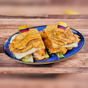 Toston Loco Pescado with fried plantains, cheese, and lettuce, Colombian cuisine.