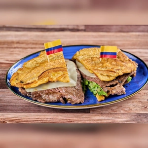 Tostón Loco Carne with fried plantains, beef, and cheese. Colombian cuisine. City unknown.