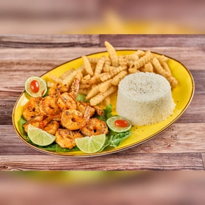 Grilled shrimp with lime wedges, crinkle-cut fries, and a mound of white rice on a yellow plate. Cuisine type and city