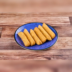 Extra Yuca Frita on a blue plate with crispy golden yuca sticks. Cuisine type and city unknown.