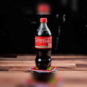 Plastic Bottle Soda, Coca-Cola with red label and cap on a wooden surface. Unknown cuisine type and city.