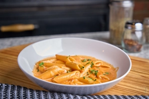 Penne alla vodka with creamy tomato sauce and parsley in New York.