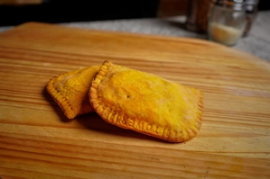 Beef patties with a golden crust on a wooden board. New York.