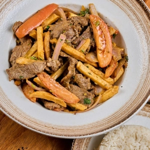 Lomo Salteado / Sauteed Beef with Onions and Tomatoes