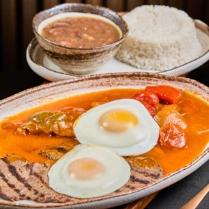 Bistec A Caballo / Steak in Creole Sauce Topped with Eggs