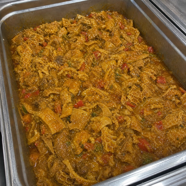 Callos with visible tripe and red peppers at a Latin restaurant in Carrollton.