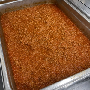 Bolognese sauce with visible ground meat and tomato in Carrollton.