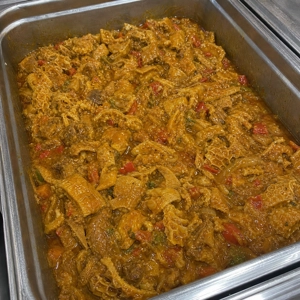 Callos with visible tripe and red peppers at a Latin restaurant in Carrollton.