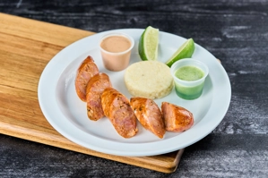 SAUSAGE W/ POTATOES OR MINI AREPA