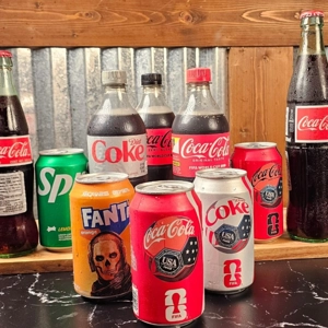 Mexican Coke Bottle with glass and plastic bottles of Coca-Cola, Diet Coke, and Sprite at Super Tacos in Dacula.