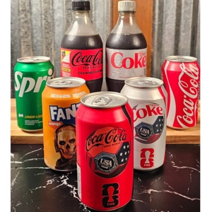 Sodas En Lata with cans of Coca-Cola, Sprite, and Fanta in Dacula.