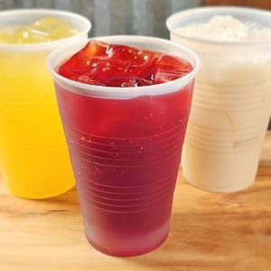 Aguas frescas in Dacula with red hibiscus drink, yellow citrus drink, and creamy white horchata.