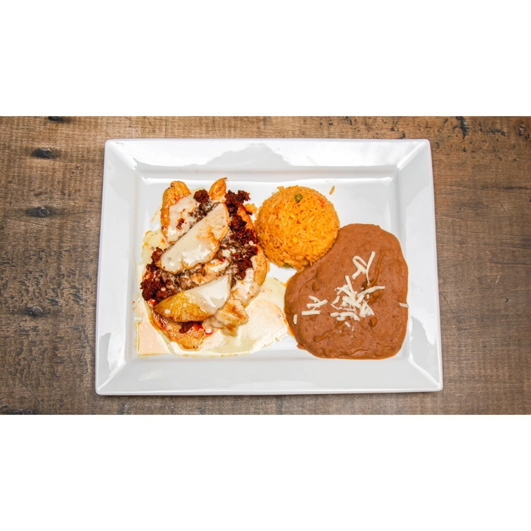 Chori Pollo with grilled chicken, Mexican sausage, and melted cheese, served with rice and beans in Roanoke.