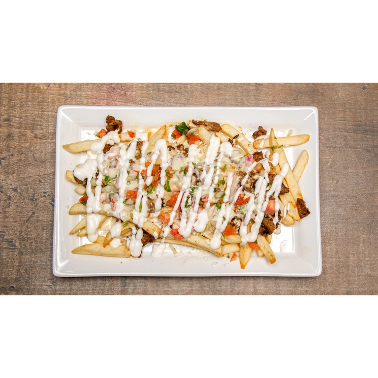 Asada fries with sour cream, pico de gallo, and cheese dip in Roanoke.