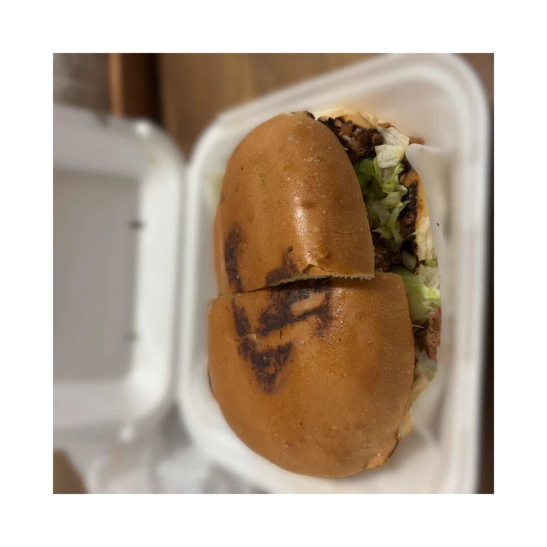 Torta Cubana with visible lettuce and sausage in Roanoke.