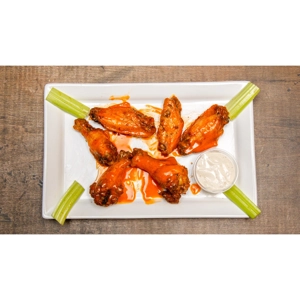 Chicken wings with buffalo sauce, celery sticks, and a side of ranch dressing in Roanoke.