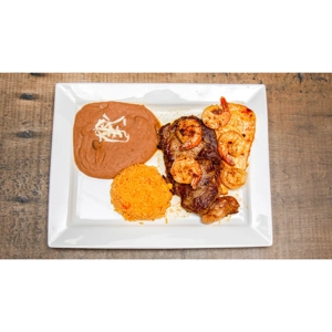 Jr. Special with rib eye steak, grilled shrimp, and chicken breast served with rice and beans in Roanoke.