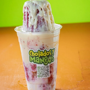 Raspado with shaved ice and condensed milk at a restaurant in Jackson Heights.