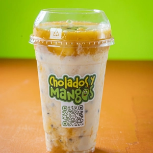 Maracuyazo drink with visible passion fruit seeds and creamy base at Cholados y Mangos in Jackson Heights.