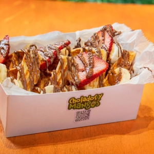 Wafflebono with strawberries, bananas, and Nutella drizzle in Jackson Heights.