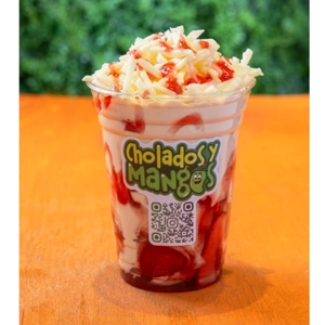 Fresas con Crema Queso with fresh strawberries, cream, and shredded cheese in Jackson Heights.