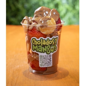 Mini pancakes with strawberries and chocolate in a cup from Cholados y Mangos, Jackson Heights.