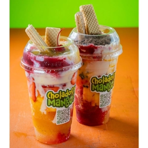 Cholado Con Todo with visible mango pieces, wafer cookies, and cherry in Jackson Heights.