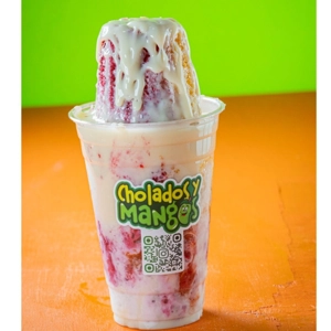Raspado with crushed ice, blackberry syrup, and condensed milk in Jackson Heights.