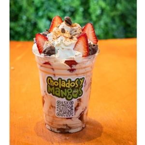 Fresas con Crema Milo with fresh strawberries, whipped cream, and Milo nuggets in Jackson Heights.