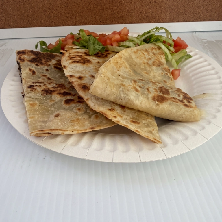 Quesadilla Harina with grilled tortilla, cheese, and side of lettuce and tomato in Hermiston.